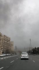 Overcast conditions observed on Tehran street from moving vehicle