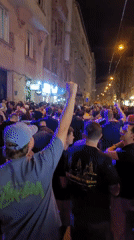 Night crowd celebrates in Budapest streets outside pubs