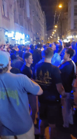 Night crowd celebrates in Budapest streets outside pubs