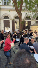 Brass band draws dancing crowds near Budapest's St. Stephen's Basilica