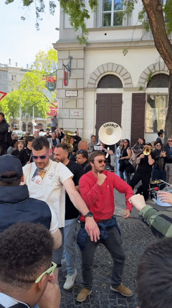 Brass band draws dancing crowds near Budapest's St. Stephen's Basilica