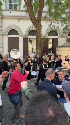 Brass band draws dancing crowds near Budapest's St. Stephen's Basilica