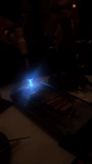 Flame torching food preparation observed at North Kuta bar