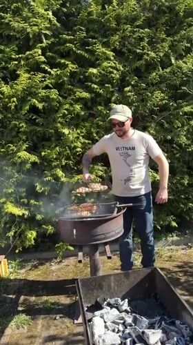 Backyard barbecue with family dog documented in Rezekne, Latvia
