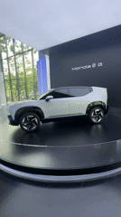 Honda concept car displayed on rotating platform in Bangkok showroom
