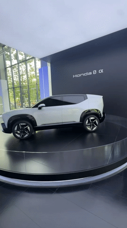 Honda concept car displayed on rotating platform in Bangkok showroom