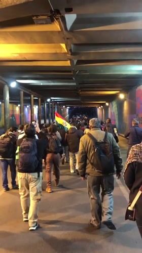 Group with COC banner marches through La Paz tunnel