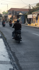 East Java neighborhood streets at golden hour, motorbikes and all