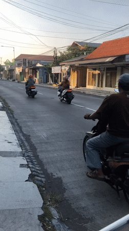 East Java neighborhood streets at golden hour, motorbikes and all
