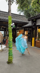 Daily life unfolds around traditional architecture in Qingyang District