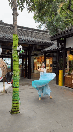 Daily life unfolds around traditional architecture in Qingyang District