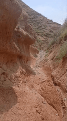 Exploring an eroded desert ravine outside Mailuu-Suu, Kyrgyzstan