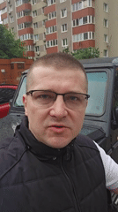 Man speaks to camera near vehicle in Kyiv