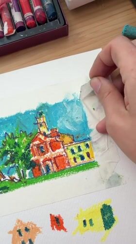 Artist works on colorful pastel drawings in Bat Yam studio