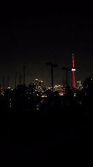 Toronto skyline and CN Tower lit up after dark