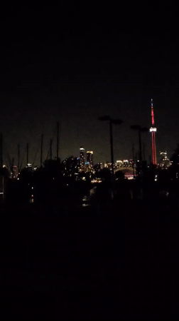 Toronto skyline and CN Tower lit up after dark