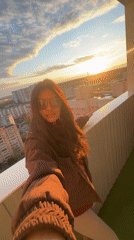 Woman records selfie videos from Moscow high-rise balcony