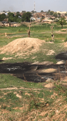 Manual earthwork and settlement activity documented in Abuja