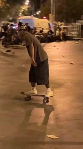 Late-night skate tricks in a Barcelona plaza