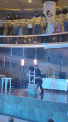Magician performs stage tricks with assistant in Turkey