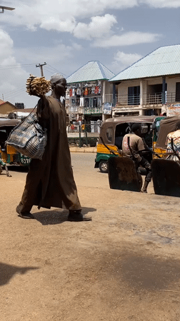 Daily street life documented in Bukuru, Nigeria commercial district