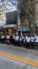 Inline skaters gather on Buenos Aires sidewalk before street event