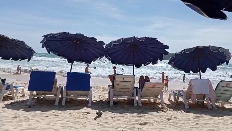 Karon Beach morning: red flag flying, crowds settling in