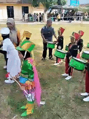 Youth marching band performs outdoor concert in Sambirejo, Indonesia