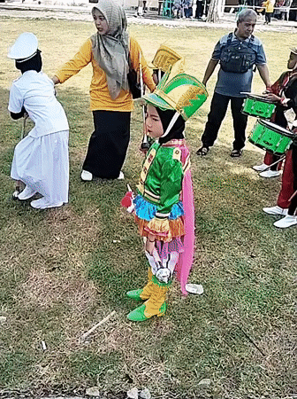 Youth marching band performs outdoor concert in Sambirejo, Indonesia