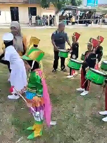 Youth marching band performs outdoor concert in Sambirejo, Indonesia