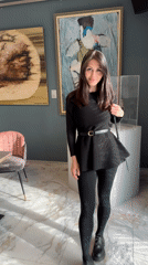 Woman in black visits Saint Petersburg art gallery