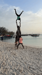 Tourists enjoy beach activities, pyramids at Kendwa Tanzania sunset