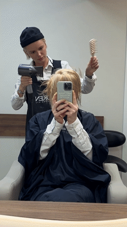 Woman gets manicure at Budva nail salon, samples pink polish