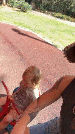 Woman films playground selfie with child, dog in Kiryat Motzkin