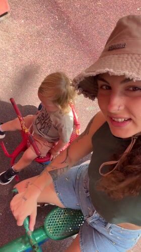 Woman films playground selfie with child, dog in Kiryat Motzkin