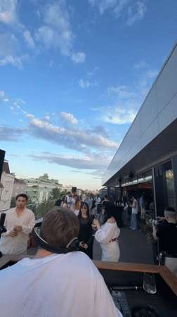 Rooftop DJ performance draws crowd in Kazan at sunset