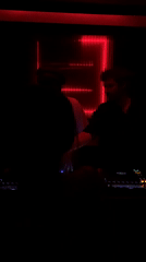 DJ performs at Tel-Aviv nightclub with red LED displays