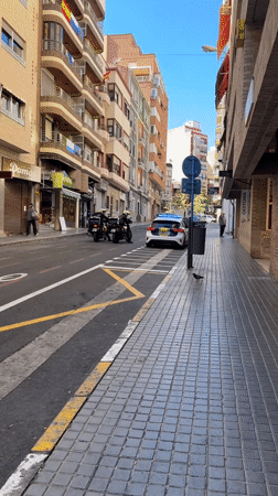 Street scenes captured in Alicante include mural, police presence