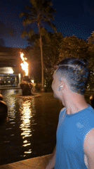 Man photographed by water feature in Indonesian city