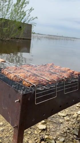 Outdoor grilling and wading observed near Russian shoreline