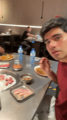 Solo diner films Korean BBQ meal in Barcelona