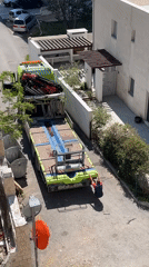 Construction truck with crane parked on residential street