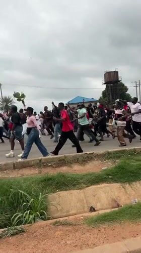 Protesters march in Nyanya with "Stop the Killing" banners