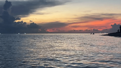 Evening coastal life documented in Thai beach community