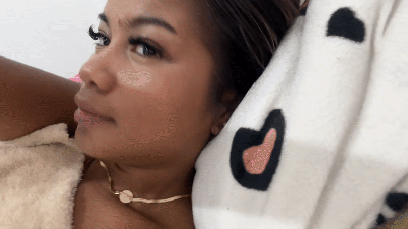 Woman rests on spotted pillow in Celuk, Indonesia