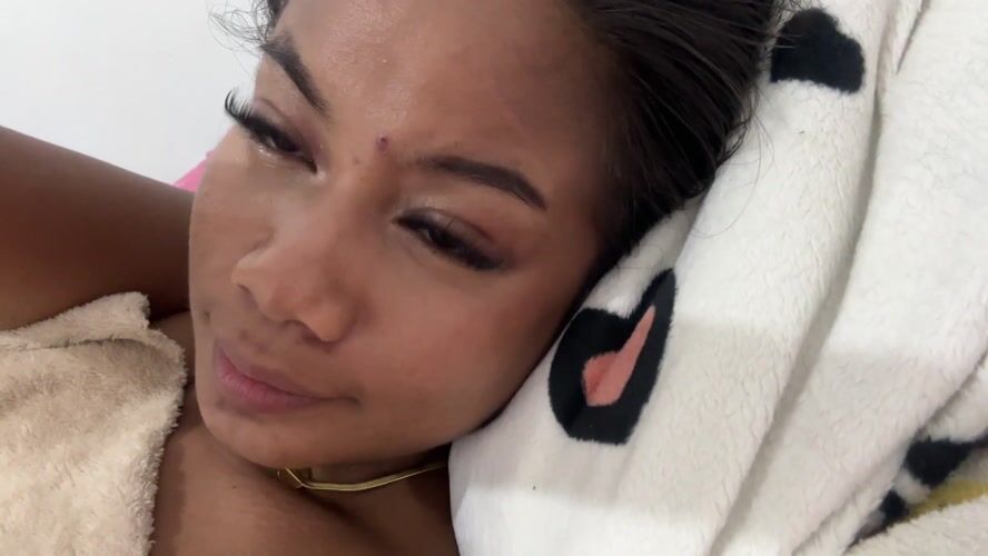 Woman rests on spotted pillow in Celuk, Indonesia