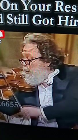 The video displays text overlayed on multiple scenes. The first scene shows a man with curly hair and glasses playing a violin. The second scene shows a man with dark hair and a beard, laughing and looking to the right, with a woman's arm visible on the left. The third scene shows a close-up of a person wearing sunglasses and smiling. The text "When You On Your Resum Still Got Hired" is visible at the top of the screen. A red notification bell and the numbers "6655" are also visible. A thumbs-up icon with the word "Like" is present at the bottom right.
