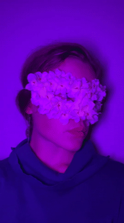 Woman photographed in floral eye masks during Budva art session