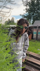 Lazy June morning in a Russian village, flowers and tractors