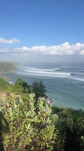 Calm coastline and green cliffs in Kuta Selatan, Bali